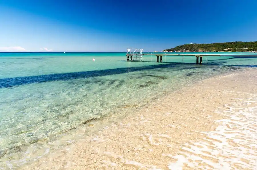 A serene view of Plage de Tahiti, a famous nudist beach in Saint-Tropez, France.

