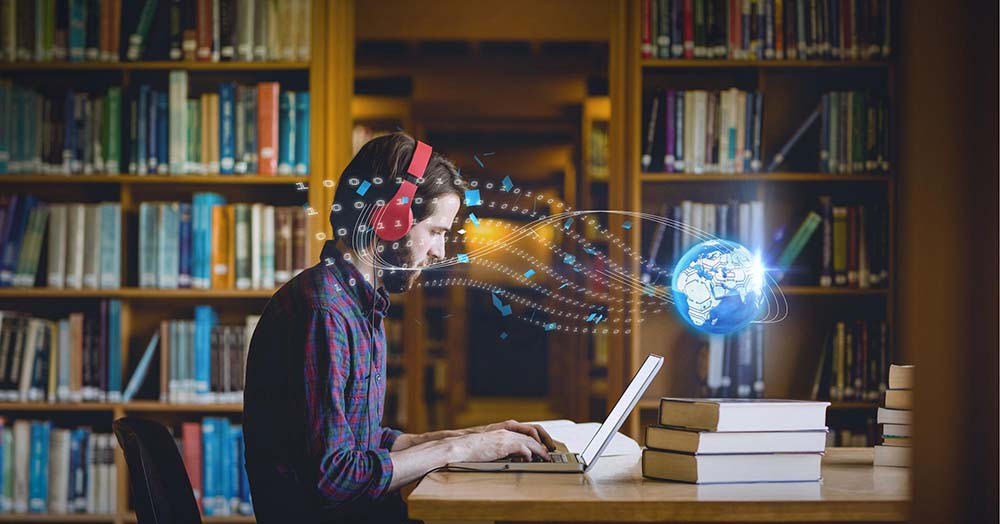 Student using laptop with AI globe data projection