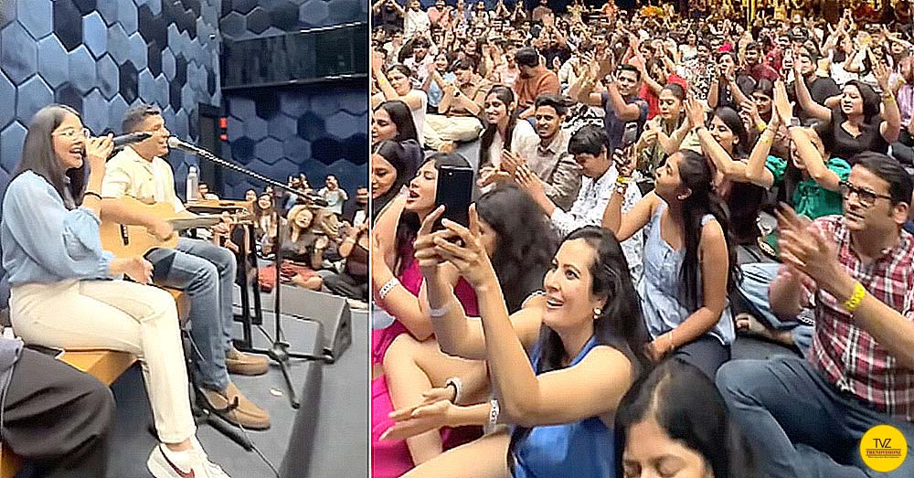 Young artists performing devotional fusion music before large youth crowd