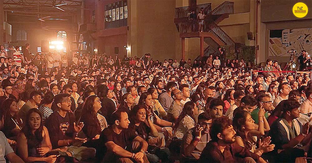 Large youth audience gathered for indoor spiritual music performance