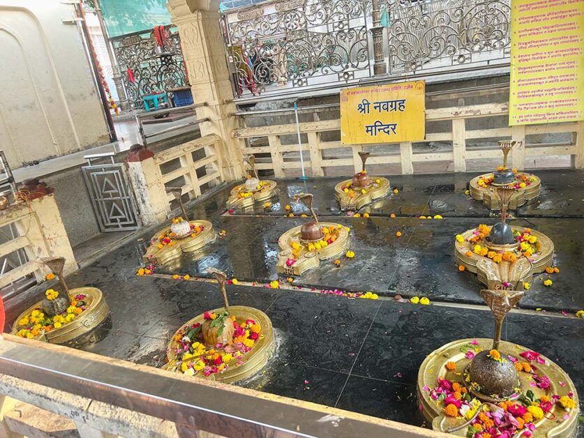 Nine Shiva lingams representing planets inside Mahakal Navgraha Temple.