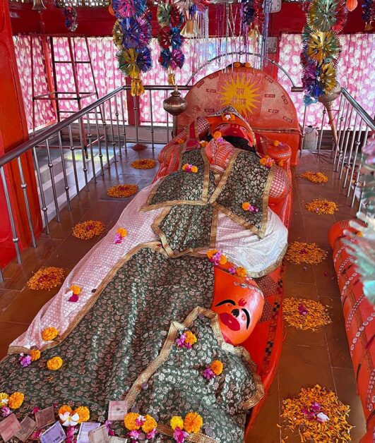 Devotees worship Patal Hanuman idol draped in sacred cloth at Omkareshwar temple