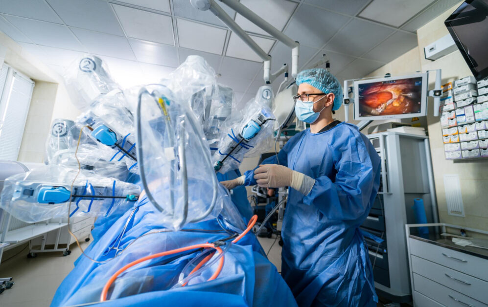 Surgeon using robotic system during minimally invasive surgical procedure.