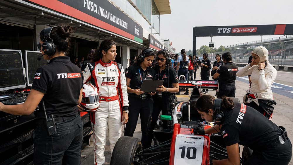 Women motorsport engineers and racers working in pit lane