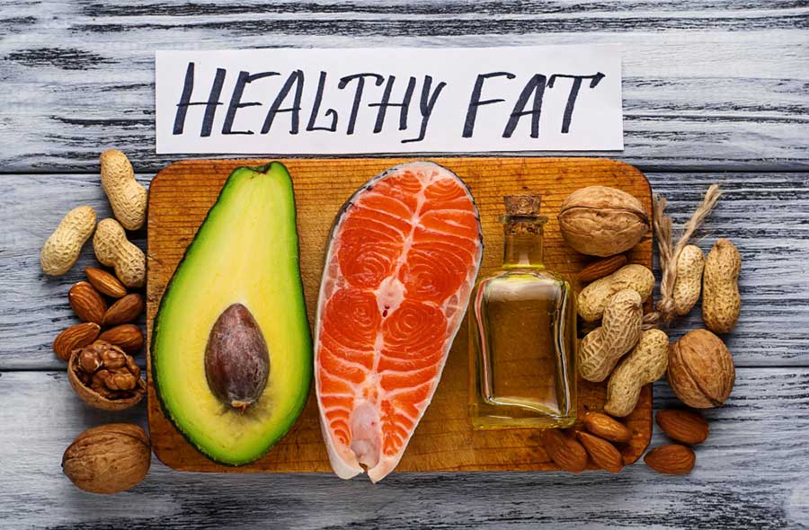 Healthy Nutrition with Healthy Fats Salmon, avocado, oil, and nuts 