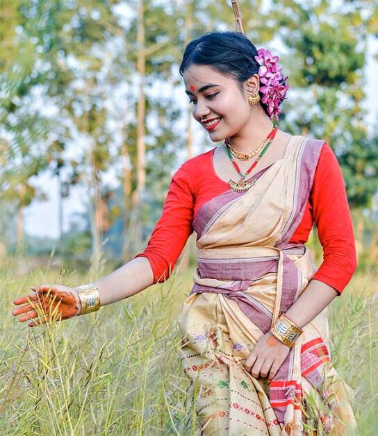 Assamese girl in traditional Bihu attire, Indian Culture jewelry.