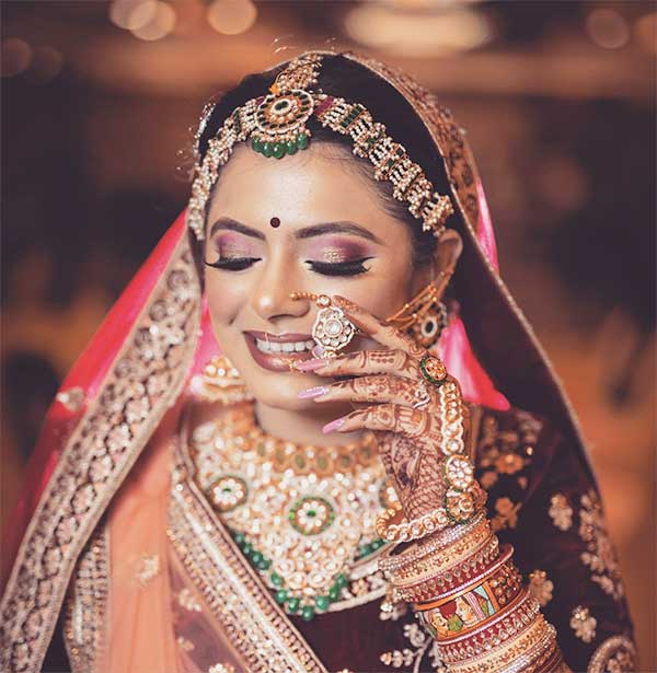 Gujarati bride's elaborate jewelry, reflecting rich cultural heritage and tradition