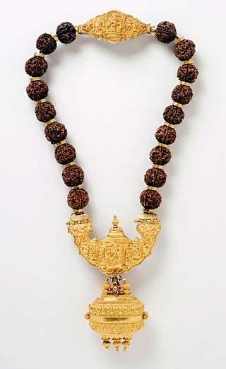 Antique 19th-century gold necklace adorned with rubies, diamond, and Rudraksha