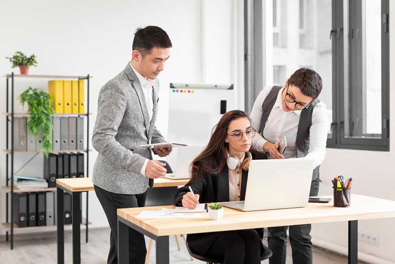 Millennials collaborating in tier 2 Job workplace