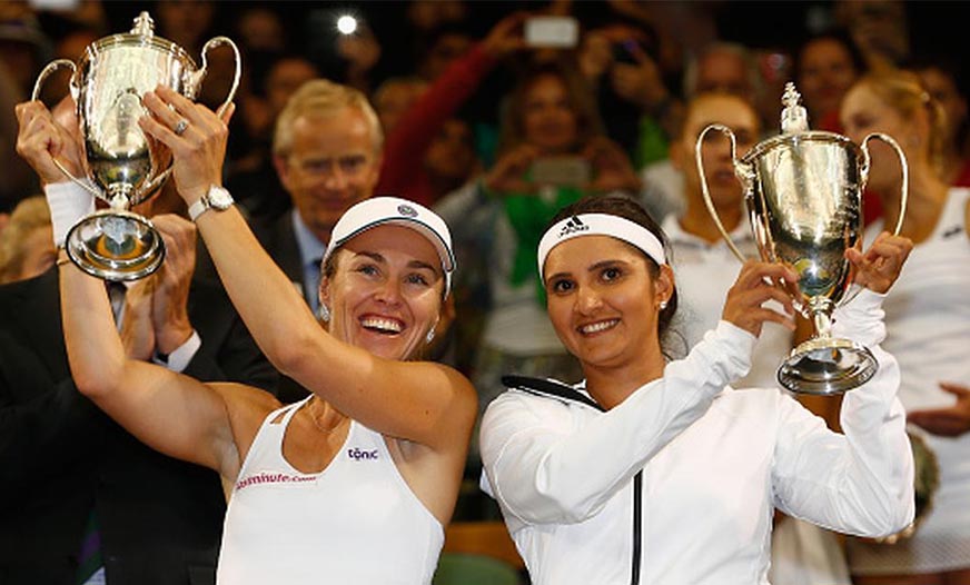 Sania Mirza and Martina Hingis celebrate their Wimbledon victory