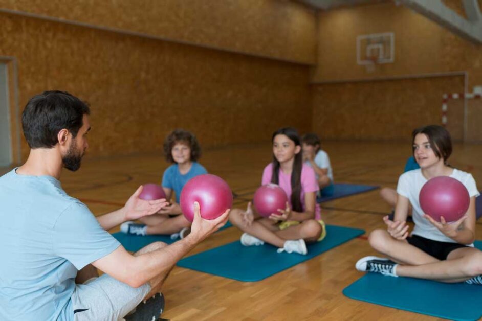 Children practicing the "breathing buddy" mindfulness activity.