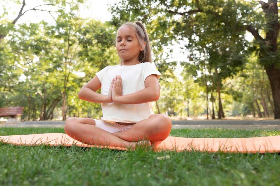 Child practicing mindfulness activities for emotional resilience and focus.