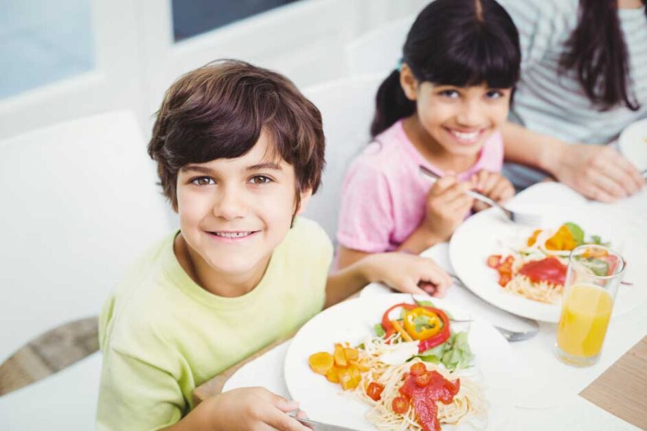 Children practicing mindful eating, focusing on food sensations