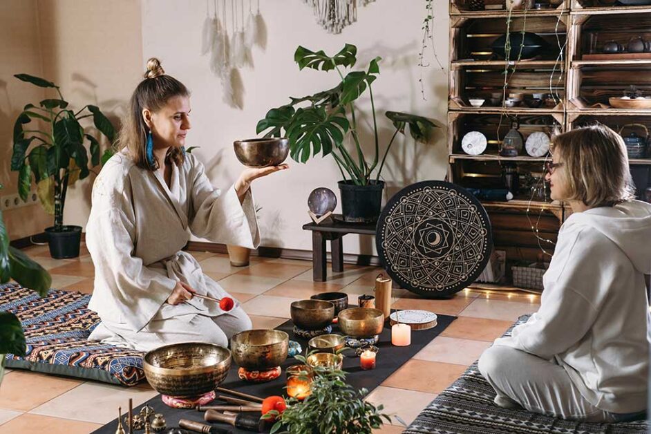 Singing bowls and percussion instruments used for sound healing therapy.