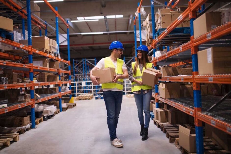 Workers organizing packages in a warehouse for efficient supply chain management