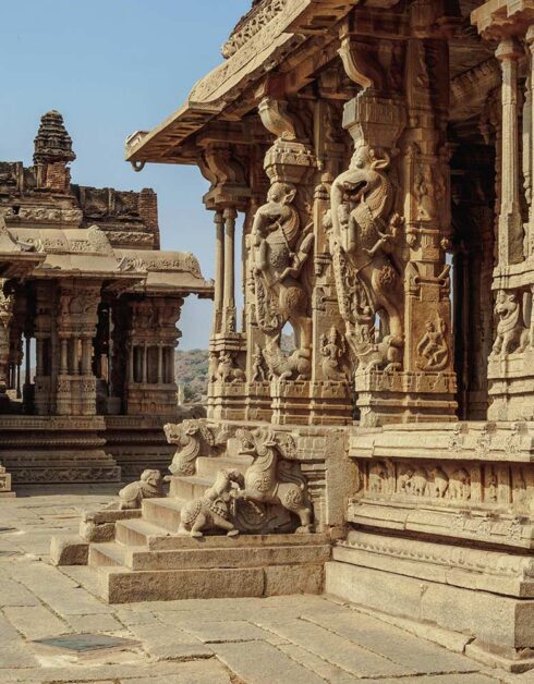 Intricate carvings at Vittala Temple, Hampi, showcasing ancient architecture.
