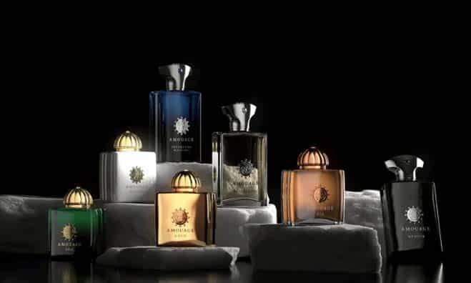 Luxury Amouage perfume bottles arranged on white marble blocks