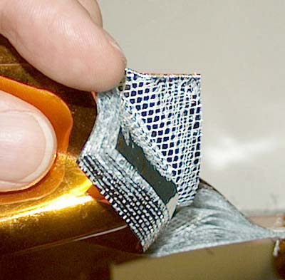 Infographic showing five materials in a multi-layer insulation stack