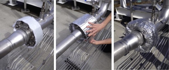 Insulation layers applied to steel industrial pipeline in stages