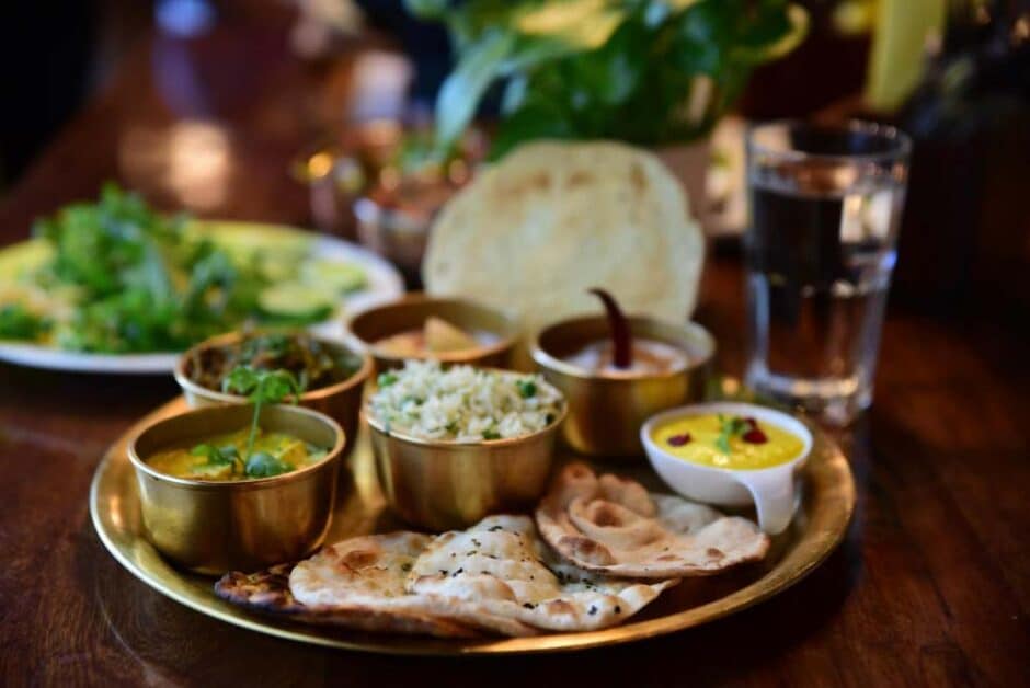 Indian thali showing chapati, rice, dal, vegetables, and salad
