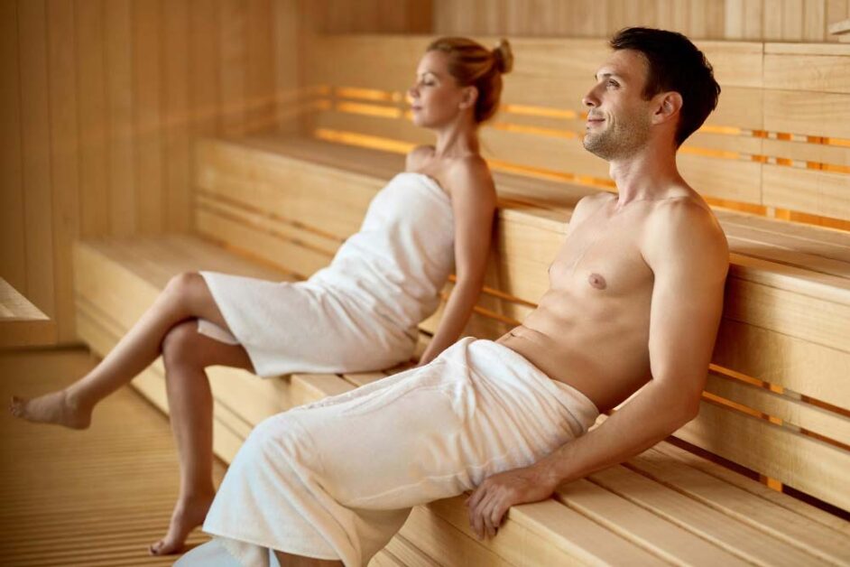 Couple enjoying a peaceful sauna session at a UK wellness retreat