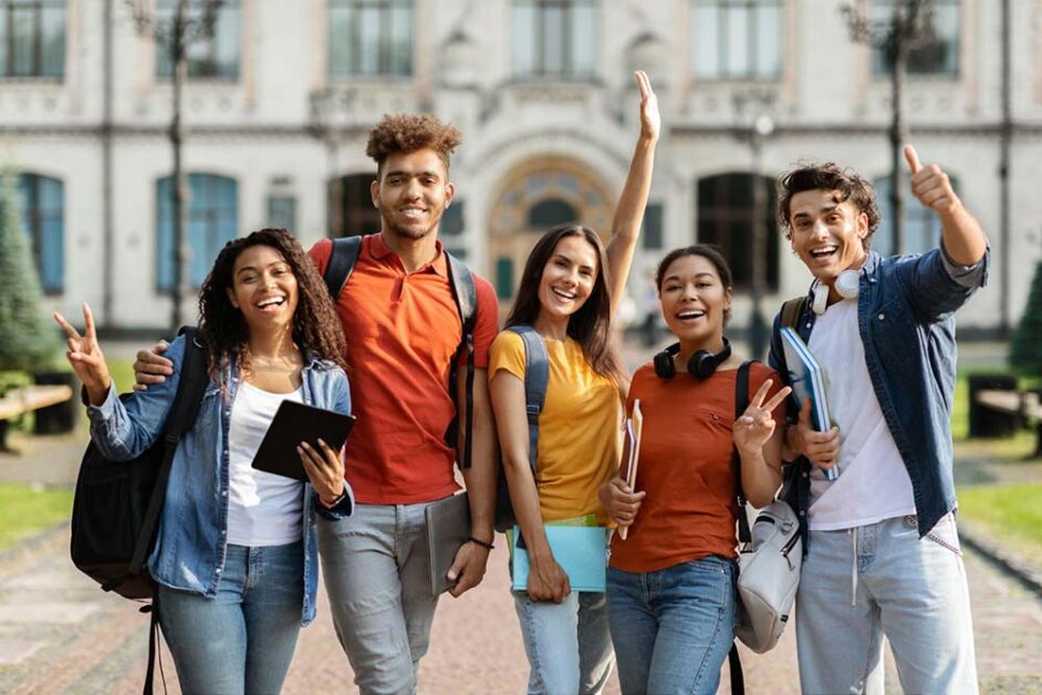 Group of diverse students smiling on a university campus