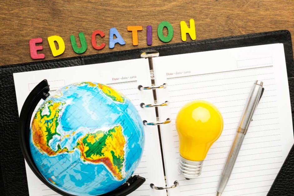 Globe, notebook, and lightbulb symbolizing global education innovation