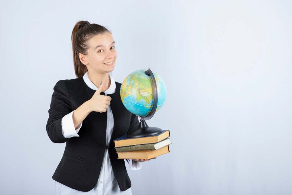 Young student holding globe symbolizing global education trends