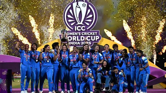 Indian women’s cricket team celebrating 2025 World Cup victory on stage