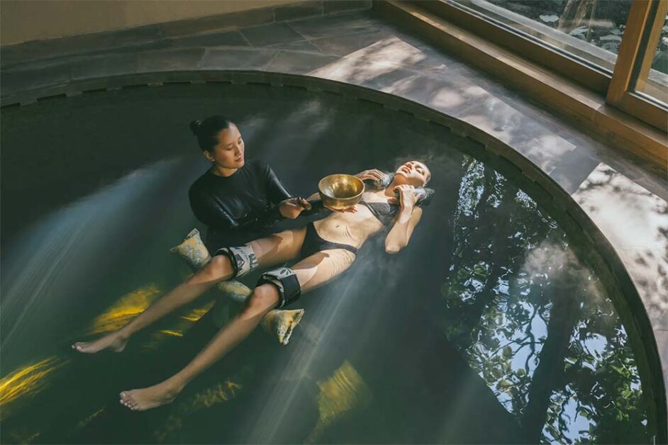 Guest receiving Watsu water therapy at Vana Retreat wellness resort