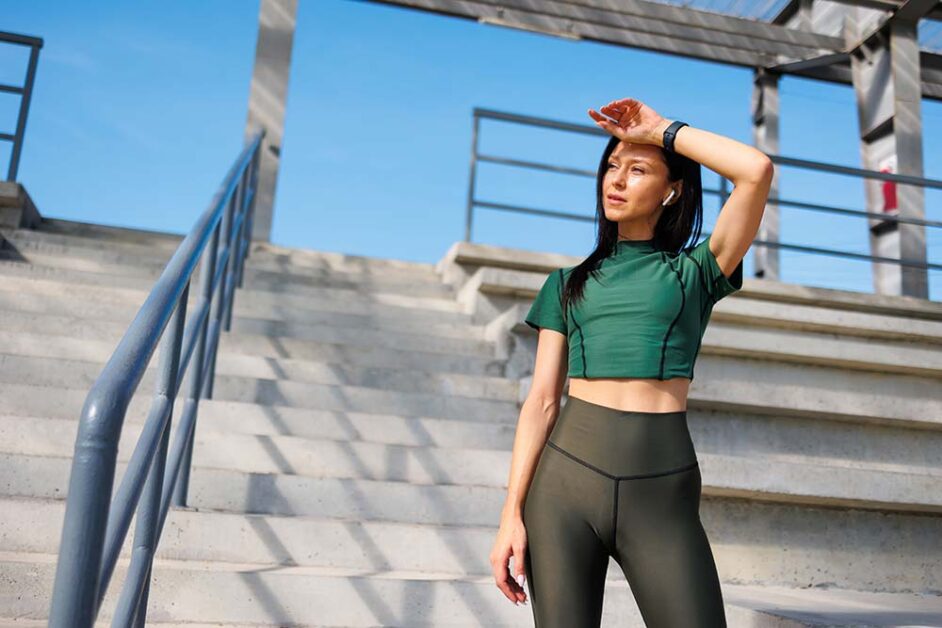 Women doing outdoor workout wearing breathable activewear in summer conditions