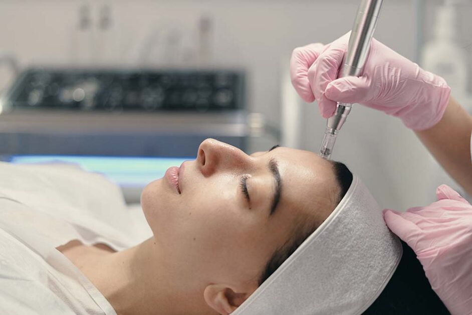 Medical professional performing skin rejuvenation treatment using advanced aesthetic technology safely