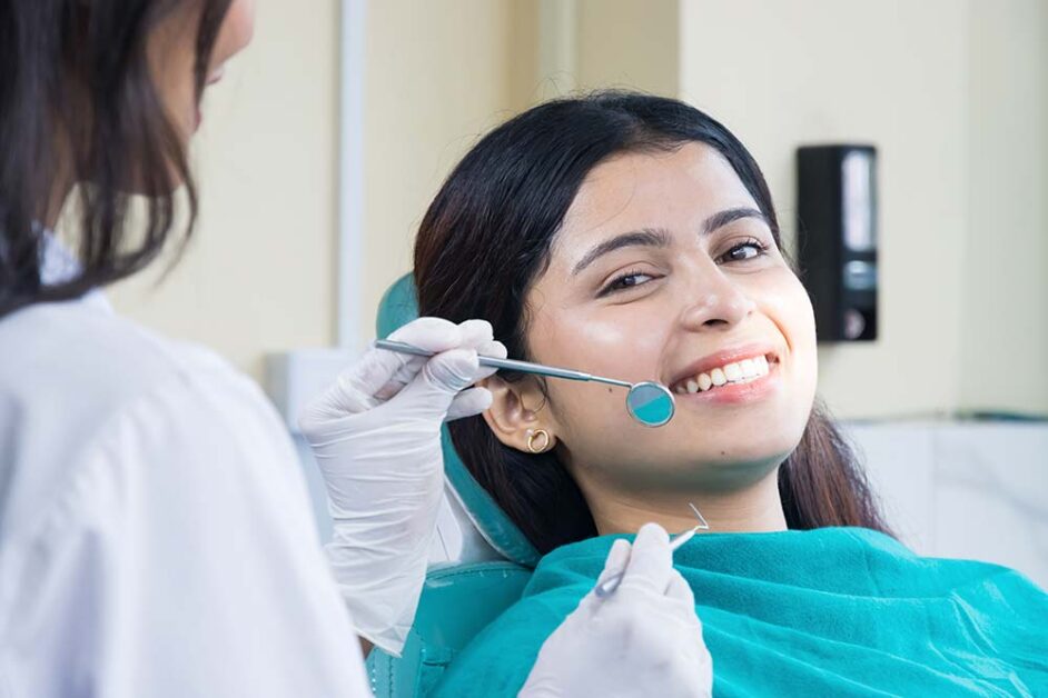 Dentist discussing smile aesthetics during personalised cosmetic dental consultation with patient