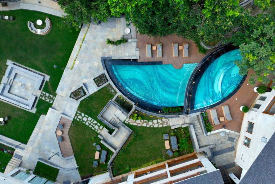 Luxury resort pool and landscaped stay experience in Rishikesh